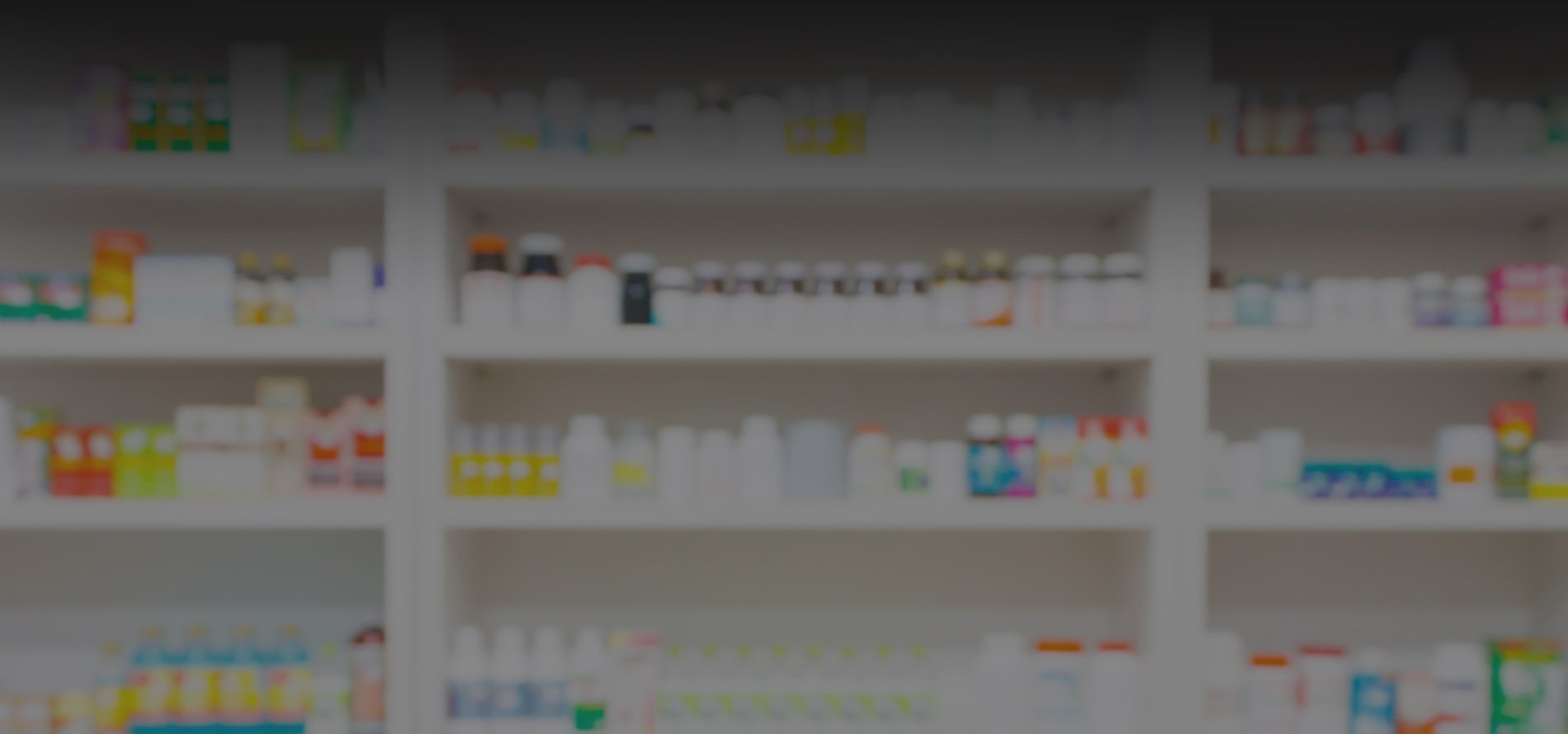 rows of pill bottles on a pharmacy shelf